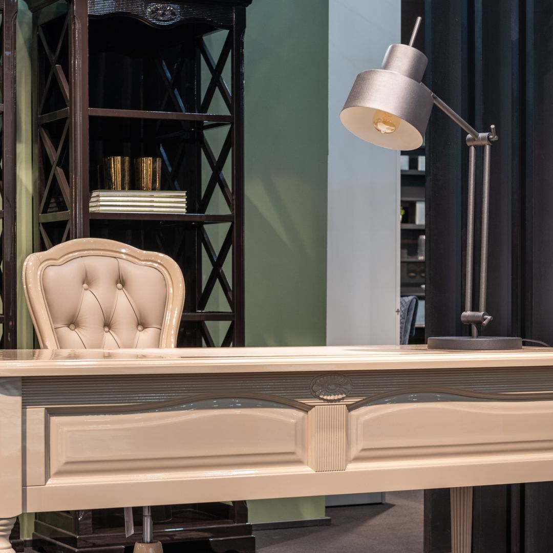 Home office desk with chair and task lamp